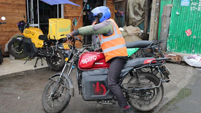 A rider sits on an electric Spiro motorcycle in Nairobi, Kenya, on Feb. 24, 2026.