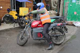 A rider sits on an electric Spiro motorcycle in Nairobi, Kenya, on Feb. 24, 2026.
