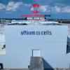 Aerial view of Ultium Cells manufacturing facility with branded signage and loading docks under blue sky
