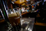 A pint of Guinness beer is poured on St. Patrick's Day on March 17, 2023, in Bellows Falls, Vt.