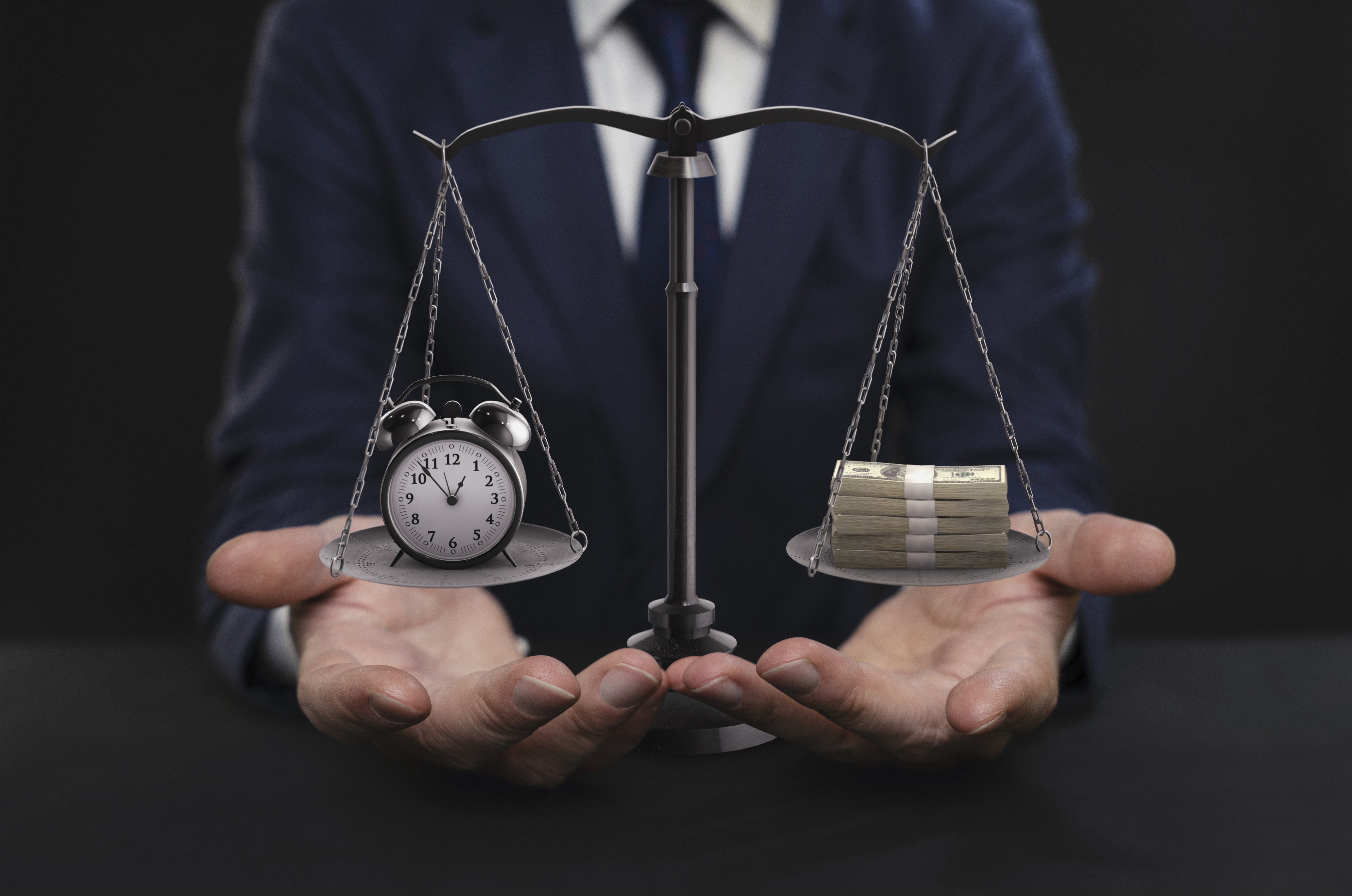 Businessman balancing time and money on scales of justice, representing work-life balance and financial priorities