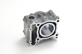 Aluminum engine cylinder head with circular bore opening and mounting bolt holes