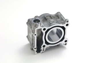 Aluminum engine cylinder head with circular bore opening and mounting bolt holes