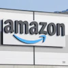 Amazon logo on industrial warehouse building exterior signage