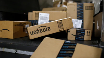 Packages in Amazon boxes move along a conveyor belt at the UPS Worldport hub in Louisville, Ky., Nov. 20, 2015.