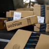 Packages in Amazon boxes move along a conveyor belt at the UPS Worldport hub in Louisville, Ky., Nov. 20, 2015.