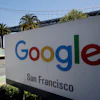 Google San Francisco sign with Bay Bridge visible in background