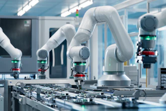 White collaborative robotic arms assembling electronic circuit boards in a modern manufacturing facility