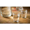 ManufacturingNow logo with glasses of water on wooden surface