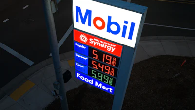 Mobil gas station price sign displaying fuel prices with Synergy branding and Food Mart services