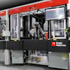 Bright Machines industrial robotic assembly system with red frame, articulated robot arm, and integrated control display