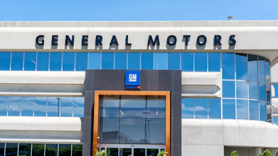 General Motors corporate headquarters building with blue glass windows and GM logo signage
