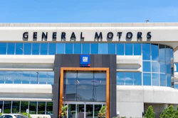 General Motors corporate headquarters building with blue glass windows and GM logo signage