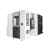 OKUMA CNC machining center with white and black exterior, doors open showing internal mechanical components and control panels