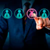 Businessman selecting a female leader icon with crown from row of employee profile icons in digital recruitment scene