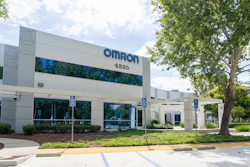 Omron corporate office building exterior with blue signage, address 4225, landscaping, and accessible parking spaces