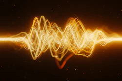 Golden glowing waveform visualization with oscillating sound waves on dark background