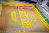 Whirlpool branded appliance component with yellow protective packaging in manufacturing facility