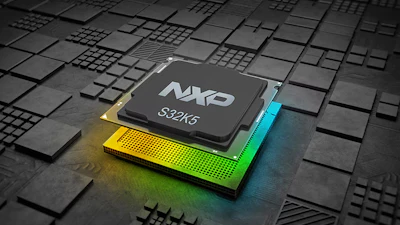 NXP S32K5 microprocessor chip on illuminated circuit board with geometric patterns
