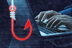 Red phishing hook icon with code and hands typing on laptop representing cybersecurity threat