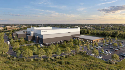 Hitachi corporate manufacturing facility with modern architecture, surrounded by landscaping and parking lot