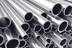 Stacked polished metal tubes and pipes arranged diagonally showing circular openings and reflective surfaces